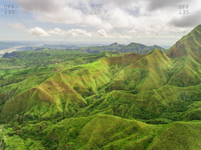 Aerial view of green hills in valley, Porac, Philippines.