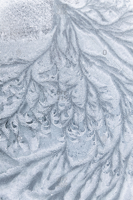 Abstract ice textures on a car window in winter
