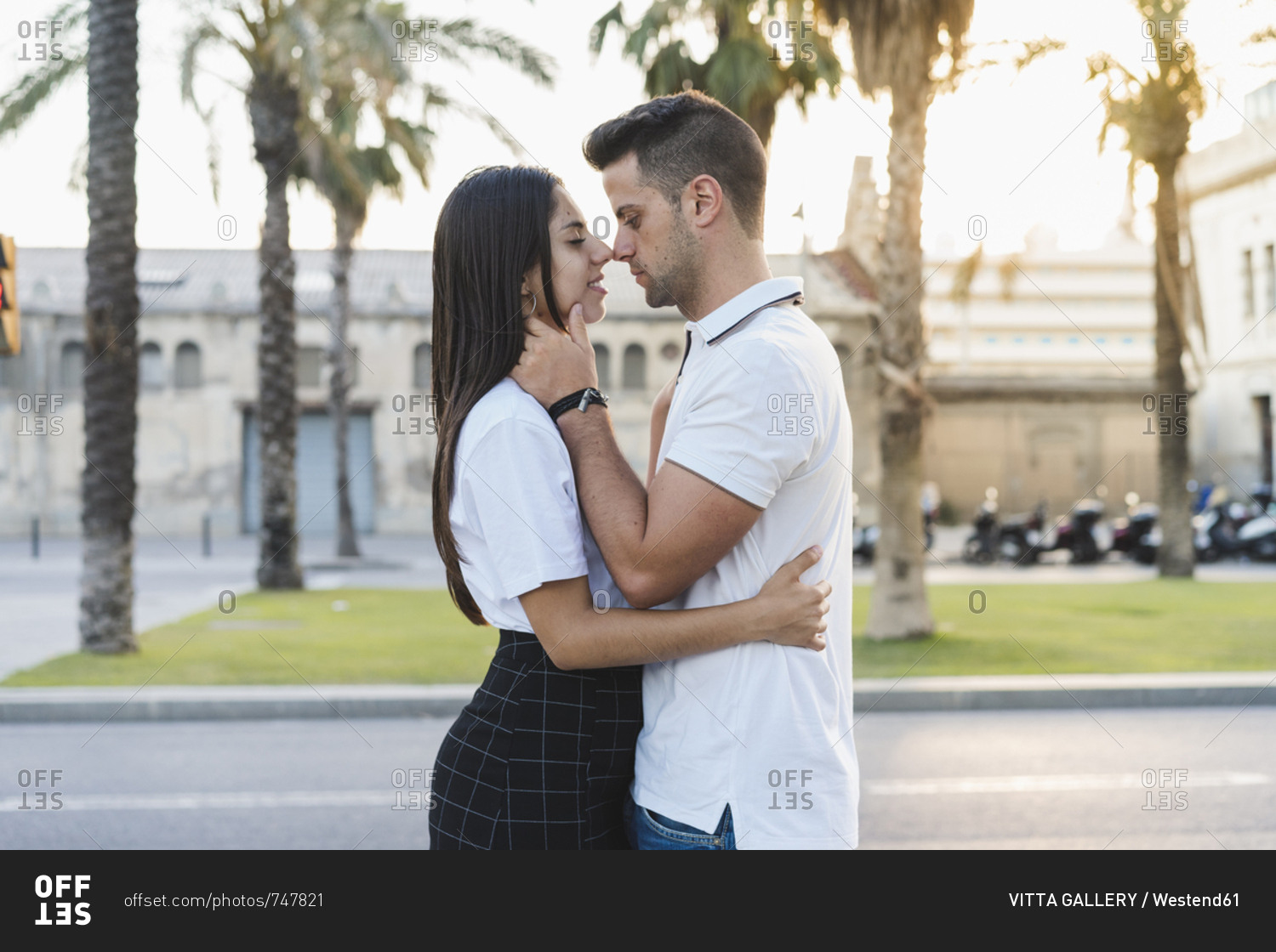 Young urban couple falling in love- kissing