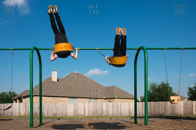 Children swinging at playground
