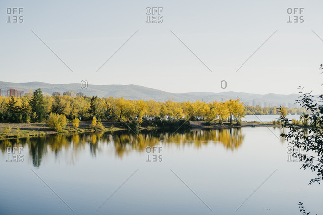 Beautiful autumn landscape in the reflection of the lake.