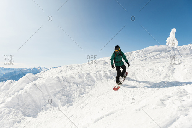 Skier skiing on a snowy mountain during winter