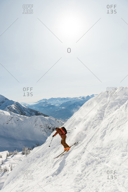 Skier skiing on a snowy mountain during winter