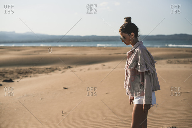 Fashionable teenage girl on the beach