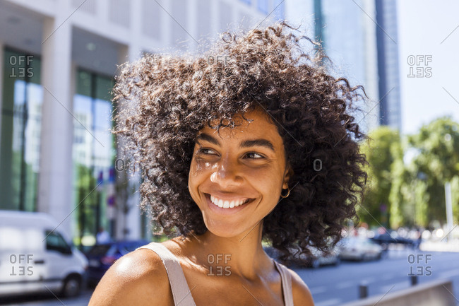 Germany Frankfurt Portrait Of Laughing Young Woman With