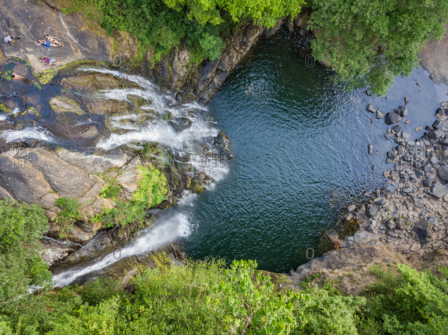 BARU WATERFALL, COSTA RICA - FEBRUARY 2018: Aerial view of Baru Waterfall and people in, Puntarenas, Costa RIca