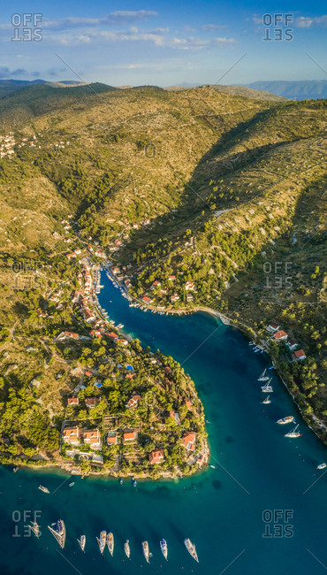 Aerial panoramic view of Sutivan town, boats and hills , Brac island, Croatia