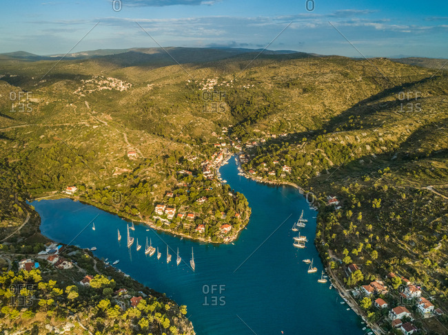 Aerial panoramic view of Sutivan town, boats and hills , Brac island, Croatia