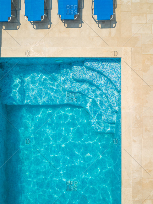 Aerial abstract view of swimming pool and loungers in Sumartin, Brac, Croatia