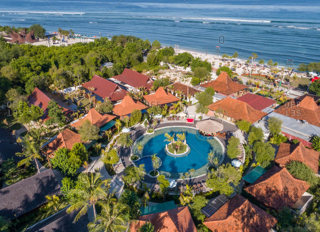 PEMENANG, INDONESIA - 10 MAY 2017: Aerial view of Pandawa Beach Villas and Resort round swimming pools, Indonesia