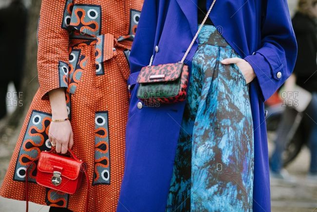 Milan, Italy - February 25, 2015: Two stylish women wearing colorful jackets
