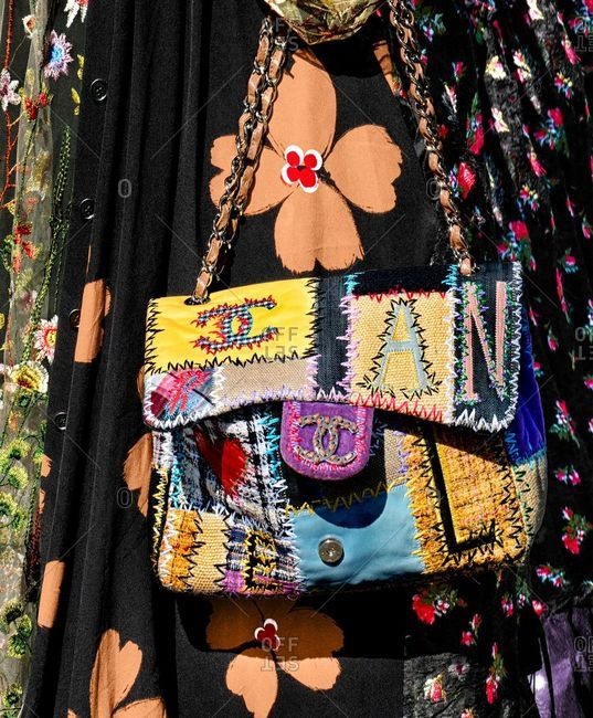 Paris, France - September 21, 2018: Woman carrying designer patchwork purse