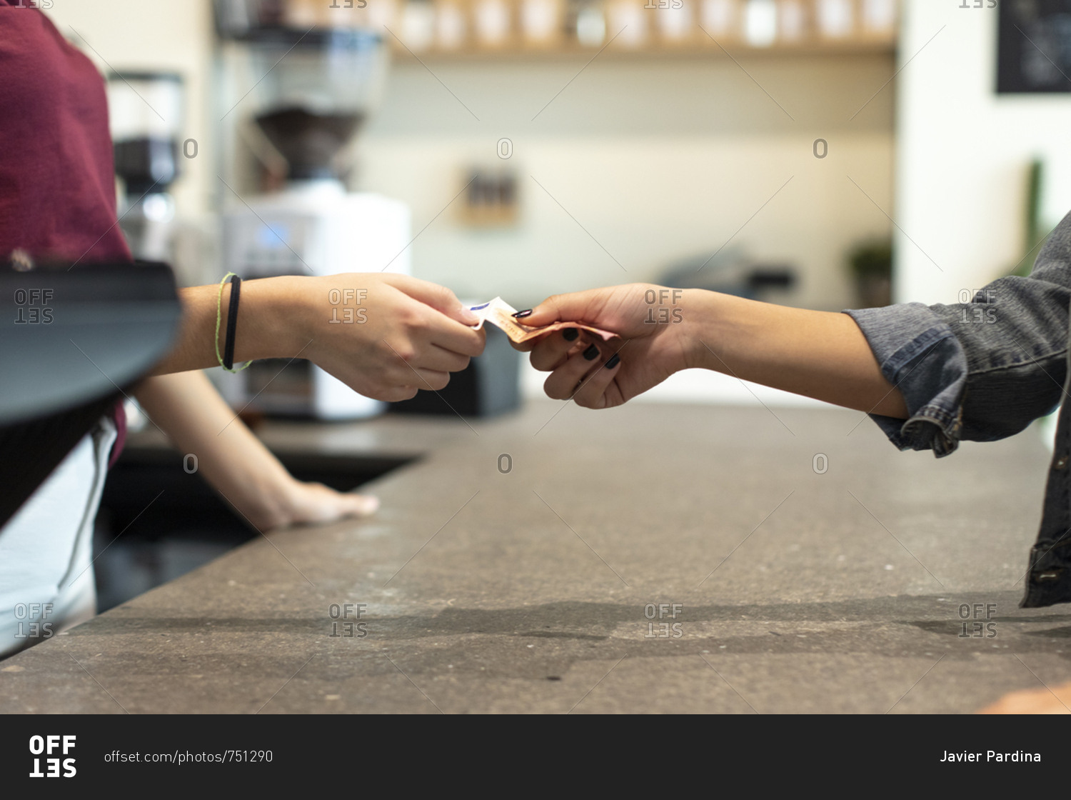 two-people-exchanging-a-euro-banknote-stock-photo-offset