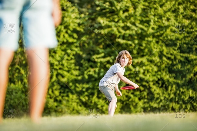 Boy throwing flying disc