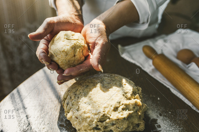 Woman Preparing Homemade Dough in the Kitchen. Preparation Raw Dough for Baking