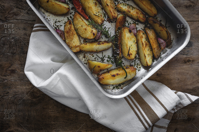 French fries golden and crunchy. With aromatic herbs. Flat lay.