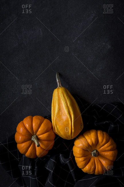 Halloween decoration background on dark background. Pumpkins. Flat lay. Copy space