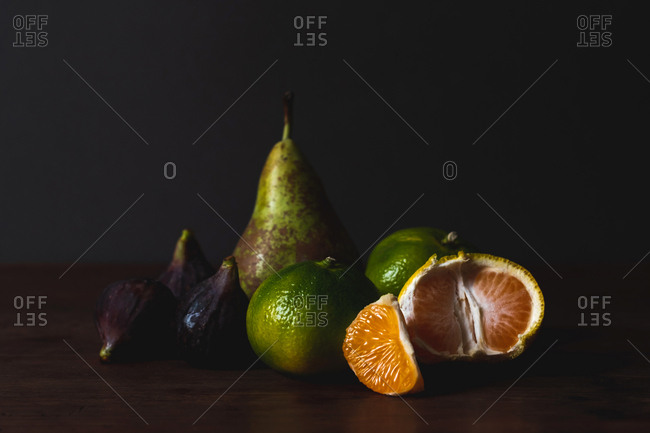 Delicious ripe fruits on table board