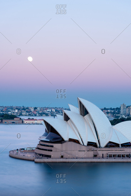 July 27, 2018: Sydney opera house at sunset against colourful magenta sky