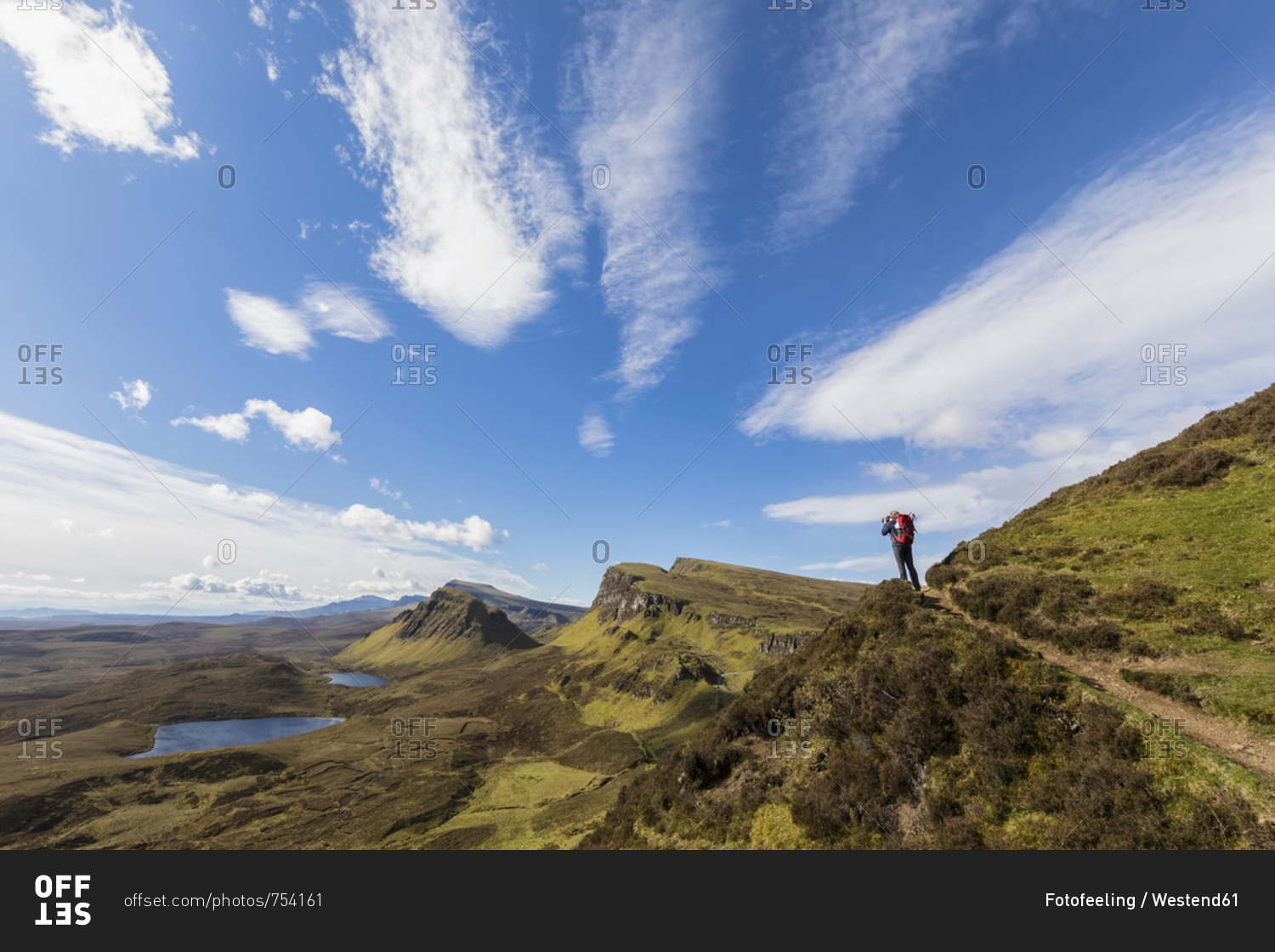 UK- Scotland- Inner Hebrides- Isle of Skye- Trotternish- Quiraing- tourist on hiking trail