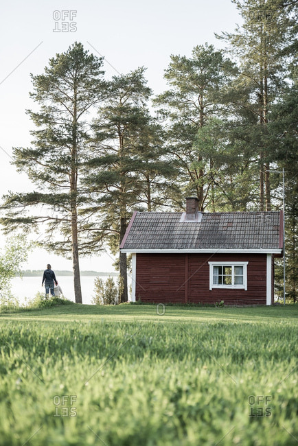 Finland Kuopio Mother With Daughter At A Cottage By The Lakeside