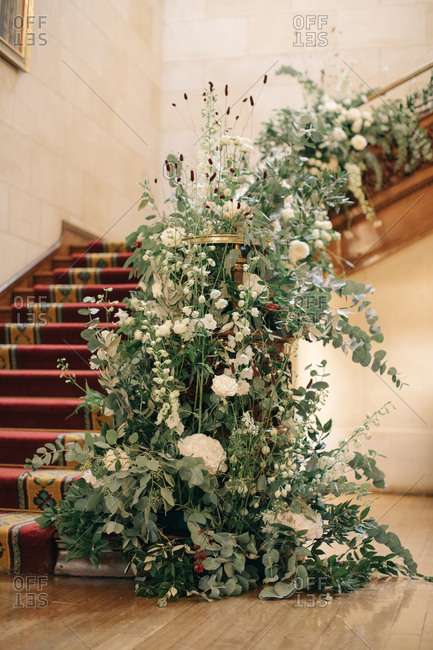 Wedding floral arrangement on stair railing
