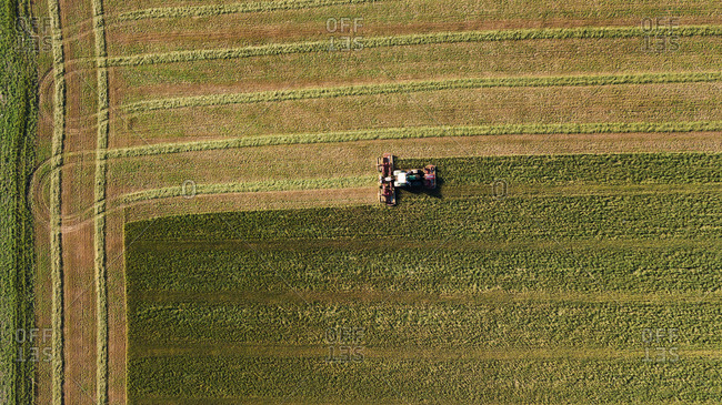 Overhead view of a tractor harvesting crops