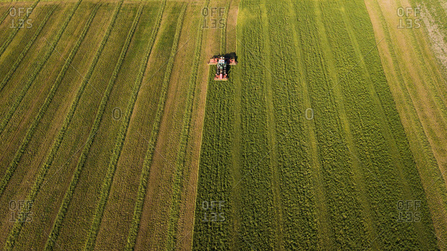 Aerial view of a tractor harvesting crops