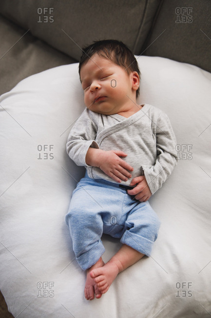 Newborn baby boy sleeping on a blanket stock photo - OFFSET