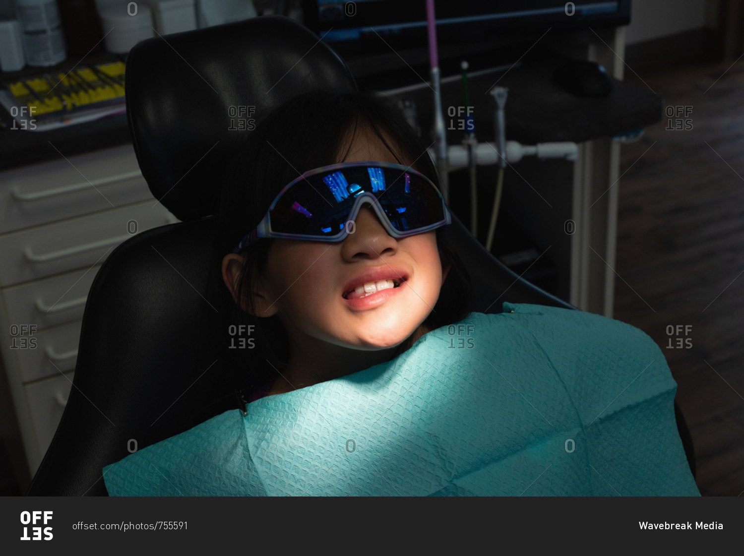 Close-up Of Patient Lying On Dental Chair In Clinic Stock Photo - Offset