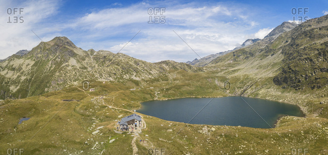Aerial panoramic of Lake Emet, Rifugio Bertacchi and peak Emet, Spluga Valley, Sondrio province, Valtellina, Lombardy, Italy, Europe