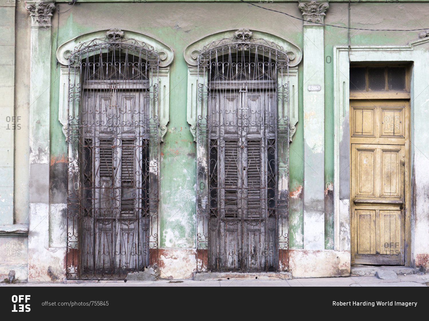 Old doorways and windows, covered by intricate metal gates, Cienfuegos, UNESCO World Heritage Site, Cuba, West Indies, Caribbean, Central America