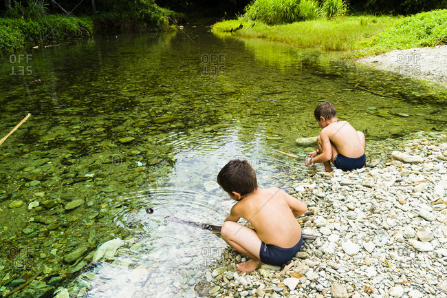 October 10, 2017: Two kids 6 and 8 years old playing in the river, Charlotteville, Tobago, Trinidad and Tobago, West Indies, South America