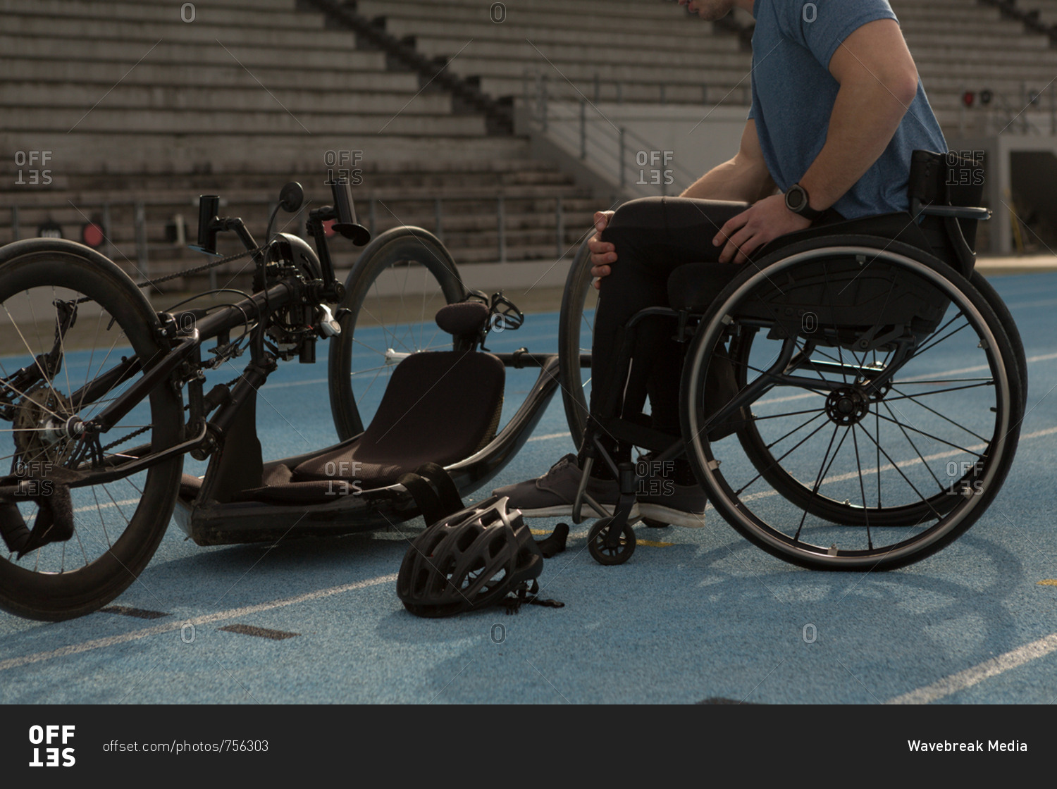 Male disabled athletic with wheelchair on a racing track