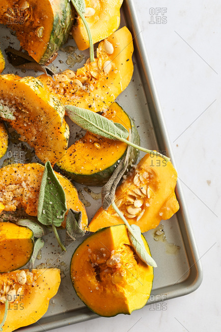 Pumpkin and sage on baking sheet