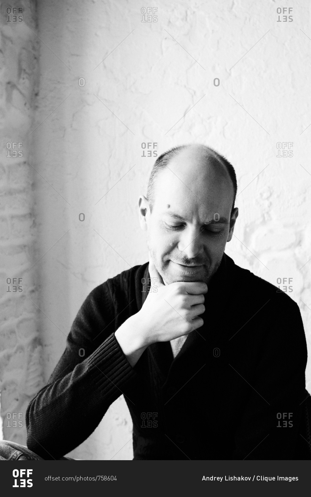 Black and white portrait of attractive middle-aged Caucasian bald man ...