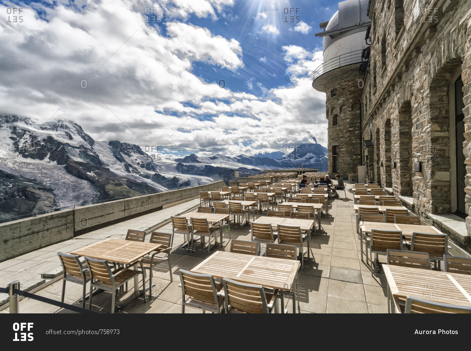 Tables and chairs on terrace of weather station on top of?Gornegrat?summit, ?Zermatt, Valais, Switzerland