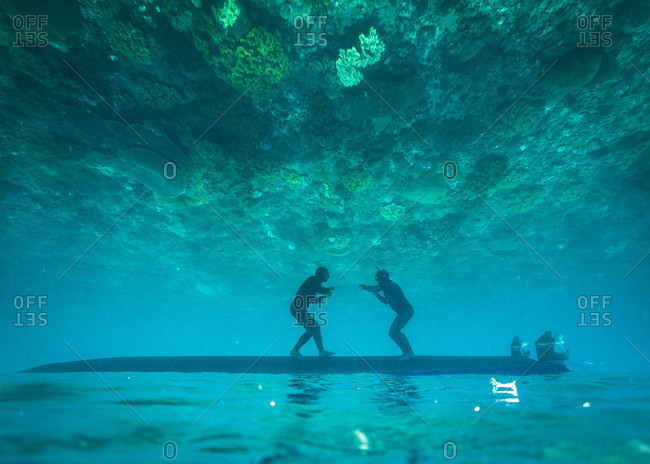 Two freedivers having fun underwater, Nusapenida, Bali, Indonesia