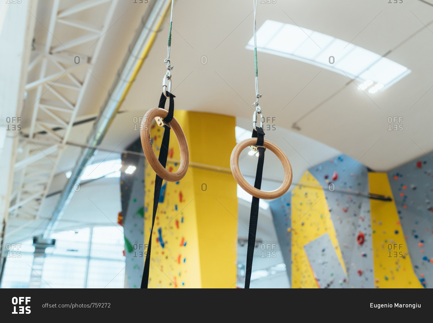 Low Angle View Of Gymnastic Rings Hanging On Ceiling Stock