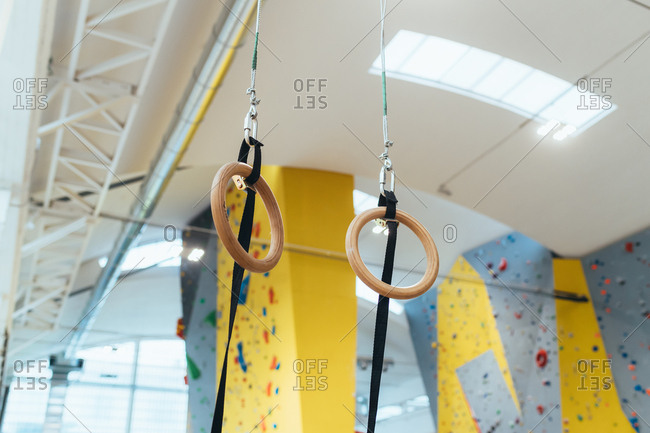 Low Angle View Of Gymnastic Rings Hanging On Ceiling Stock