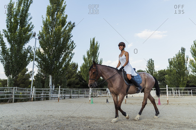 Woman riding on horse - Offset