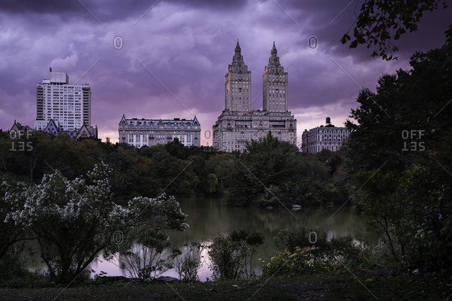 Pink sky sunset over lake in Central Park in New York City, United States