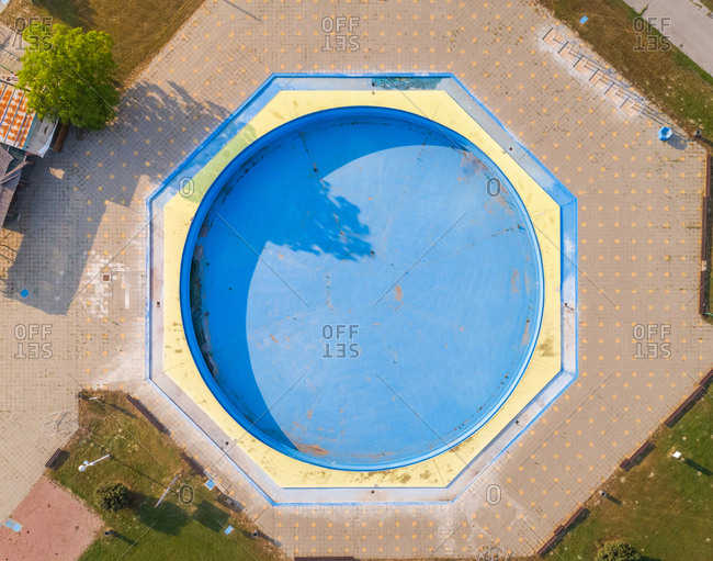 Abstract aerial view of empty pool in abandoned pool in water park.