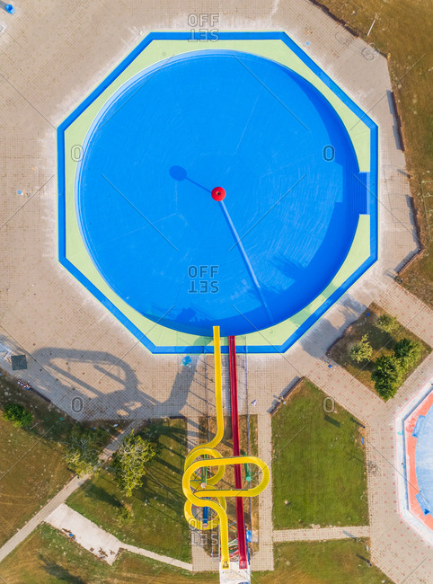 Abstract aerial view of slide and pool in abandoned water park.