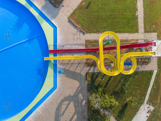 Abstract aerial view of slide and pool in abandoned water park.