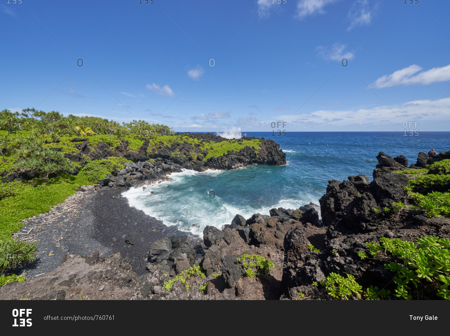 Waves rolling into the rocky coast of Hana, Maui, Hawaii stock photo 