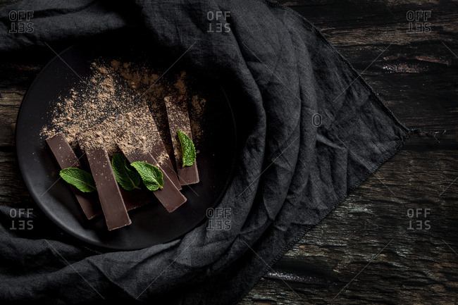 Chocolate with mint in a dark background