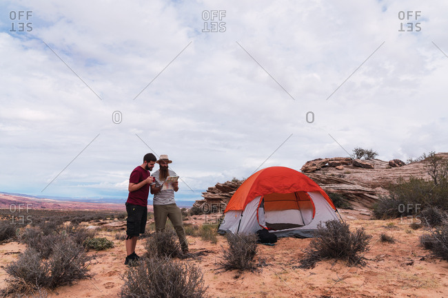 Travelers at tent with map in Grand Canyon