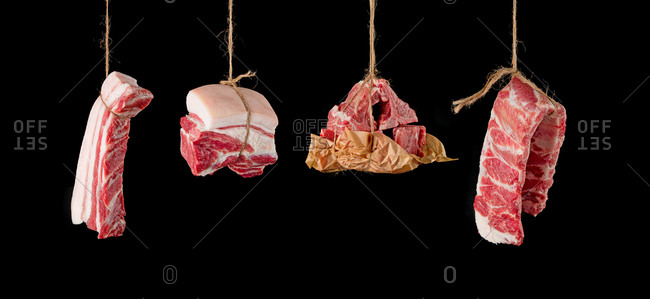 Pork hung up by rope