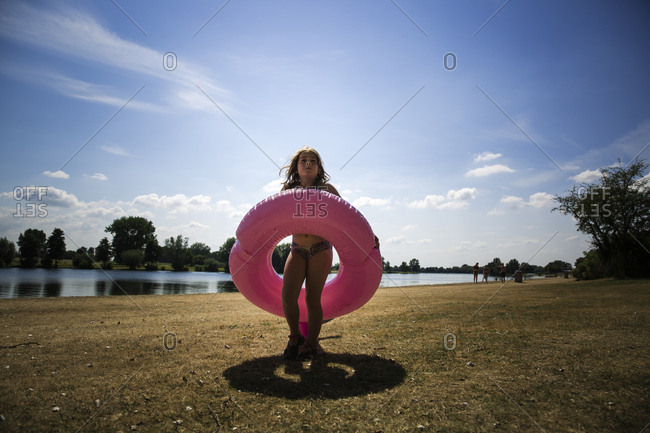 Young girl running in an innertube